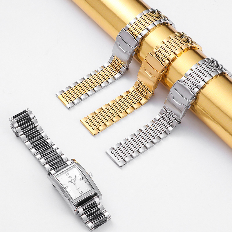 Gold, silver and two-tone classic watch bracelets on a light background
