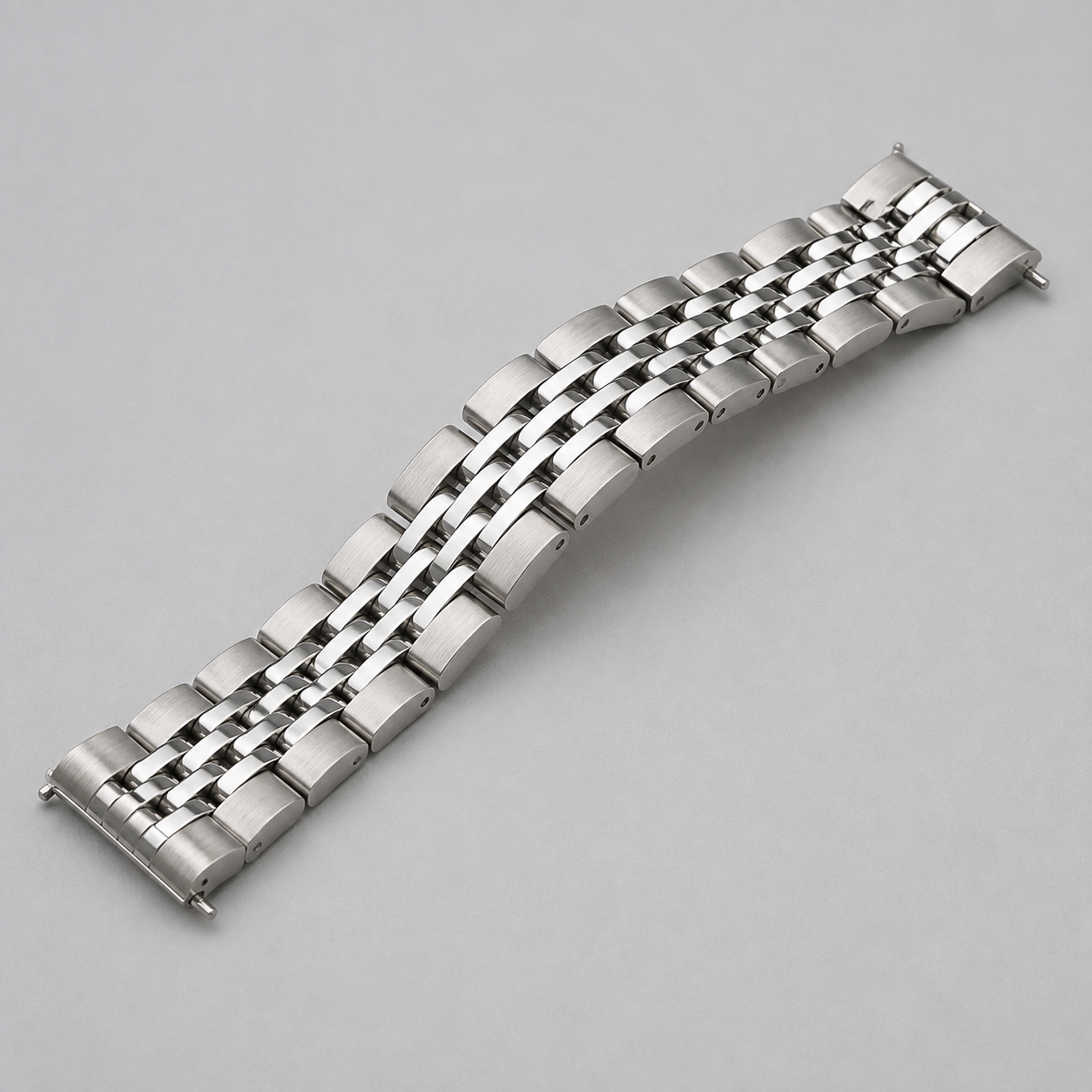AI concept of a silver multi-link traditional watch bracelet with straight ends