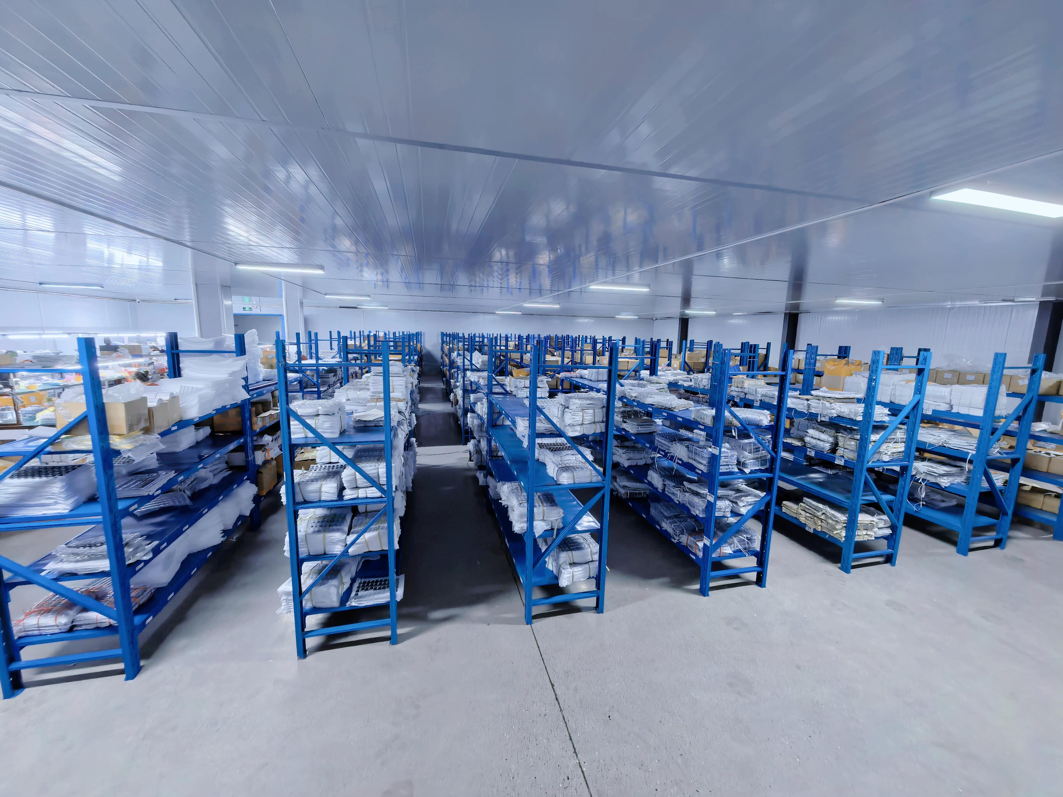 Factory storage area with rows of shelving and organized materials